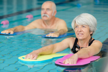 senior people in aquatic fitness class