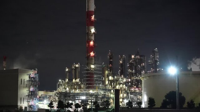Night view of  industrial complex with glowing refineries