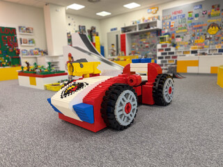 Obraz premium Colorful toy race car made from bricks