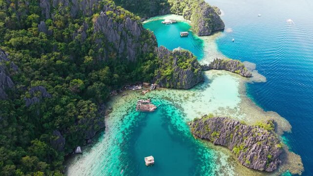 Turquoise lagoon surrounded by limestone cliffs Coron Island Palawan aerial