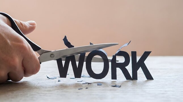 Hands using scissors to cut the word WORK printed on paper, conceptualizing a reduction in workload, job change, or life balance.