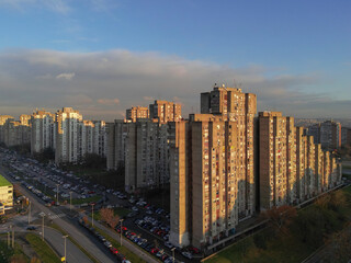 Obraz premium High angle aerial photograph of the unique stepped residential buildings in Block 63. Drone view showcasing the brutalist architecture and urban layout of New Belgrade, Serbia 12.08.2024