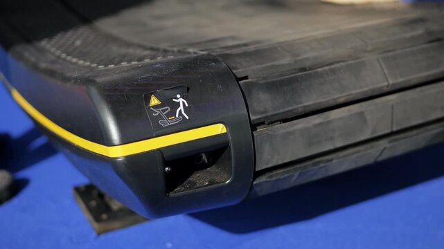 Treadmill safety warning sticker showing a person falling with a danger sign