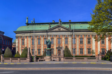Obraz premium House of Nobility in Stockholm, Sweden. Historic brick building of Riddarhuset under a clear blue sky in sunny April.