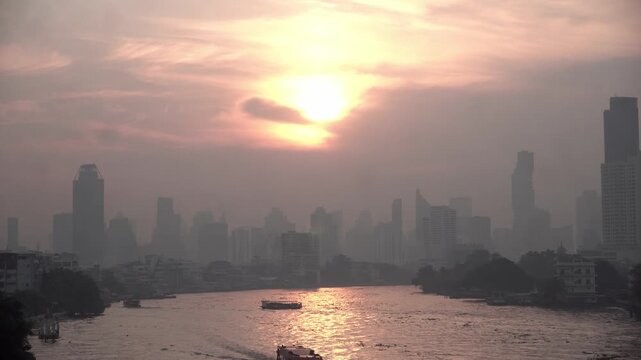Cityscape of Bangkok covered by mixture of dust in air pollution. Heavy air pollution of fine particulate matter (PM2.5) in morning.