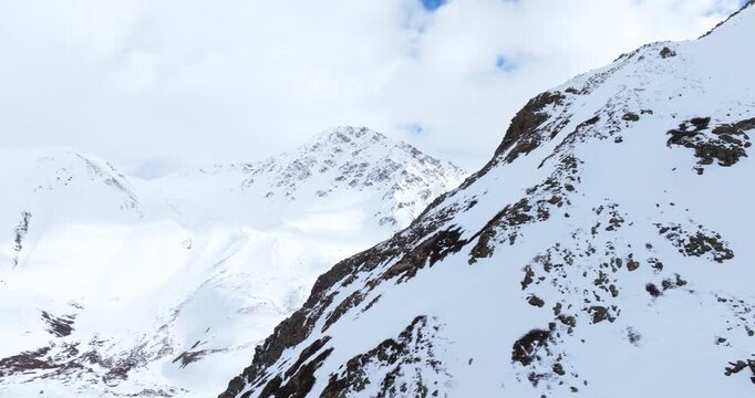 Snow-Covered Mountains Of The Tsagaan Gol (White River) Valley In Mongolia. Aerial Rotate Shot