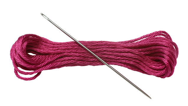 Isolated vibrant magenta embroidery floss skein and shiny metal sewing needle for craft projects