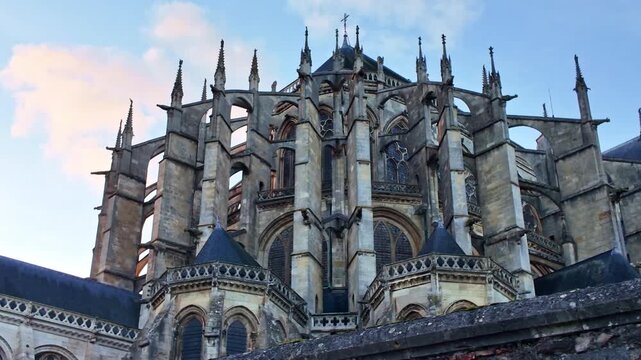 Facade panning shot of the gothic Le Mans Cathedral aka Cathedral of Saint Julian with Romanesque nave details, Le Mans, France