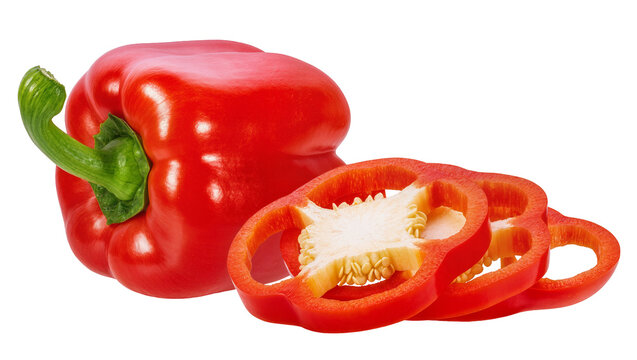 Isolated vibrant whole red bell pepper and perfectly cut fresh vegetable slices