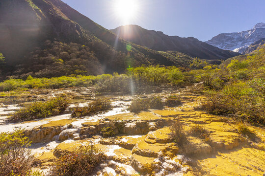 Beautiful Horseshoe Beach in Huanglong National Park, famous for its colorful pools formed by calcite deposits in Sichuan, China.