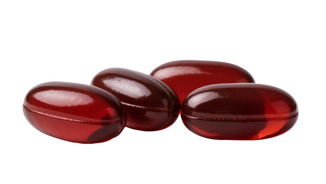 Isolated group of vibrant red softgel capsules, health supplements or medicine, close-up.