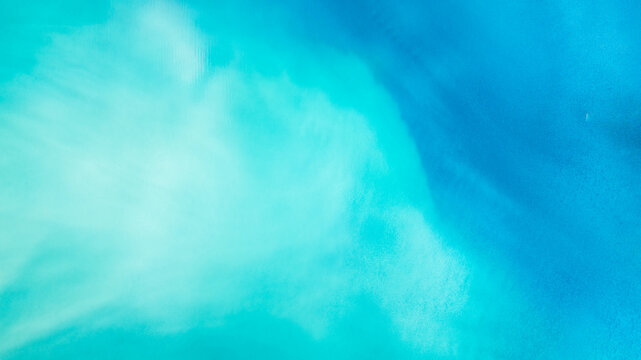 Aerial view of a serene expanse where turquoise and azure hues blend seamlessly, creating a tranquil vista of cool shades, Anterselva di Sopra, Trentino-Alto Adige, Italy.