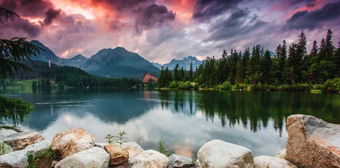 Fabulous evening view of calm lake Strbske pleso, surrounded by mountains. Location place National Park High Tatra, Slovakia, Europe. © Leonid Tit