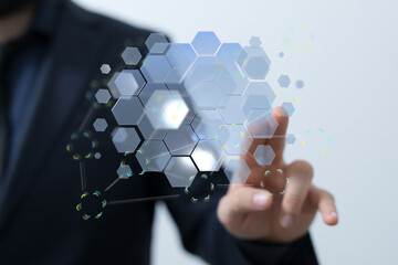 Close-up of a person interacting with a futuristic digital hexagon network. Perfect for technology...