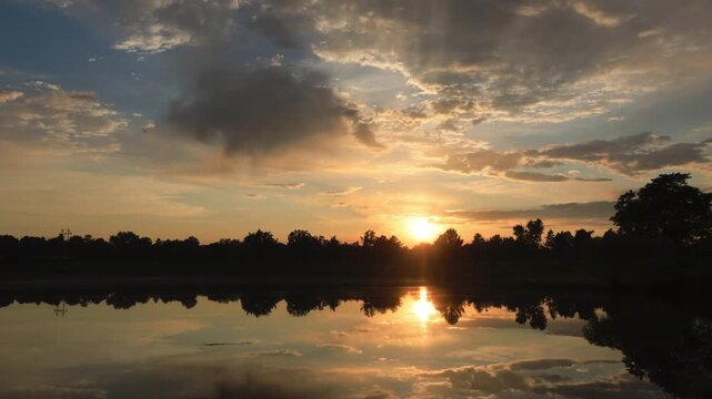 Pretty Sunset behind Lake Timelapse