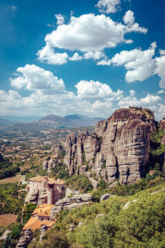 View of rugged cliffs meet the sky near ancient monasteries perched atop, nature and history intertwine under a bright sky, Kalabaka, Trikala, Greece.