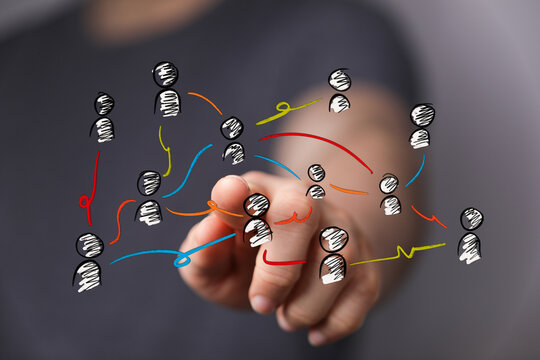 Connecting people and teams with technology, networking, hand pointing at digital connection, human connections, team wo