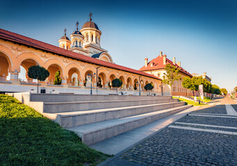 Marvelous afternoon view of Reunification Cathedral, Fortified churches inside Alba Carolina Fortress. Sunny summer scene of Transylvania, Alba Iulia city, Romania. Traveling concept background.
