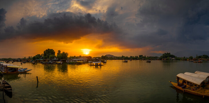 Golden Sunset Over Dal Lake with Shikara Boats and Dramatic Clouds Panorama