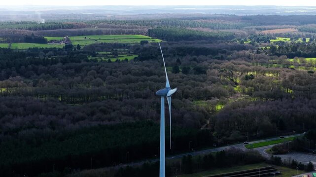 Aerial view of a lone wind turbine and renewable energy windmill with Sherwood Forest background, sustainable power generation in rural Nottinghamshire landscape, UK.