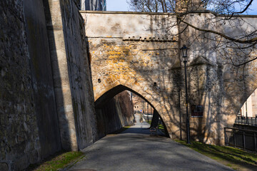 Naklejka premium path under the stone bridge in the old town