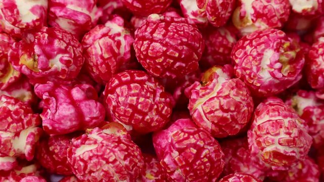 Bright red cherry cinnamon popcorn circle rotation close up