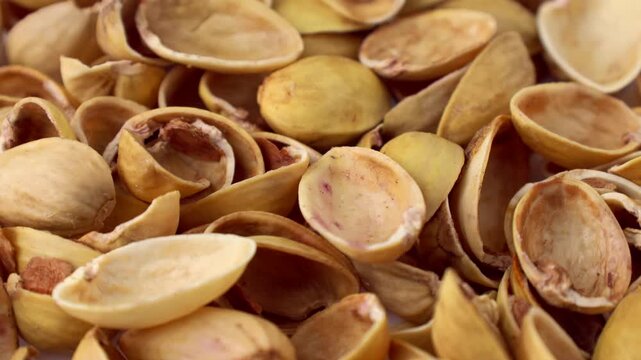 Pistachio nuts shells texture circle rotation close up