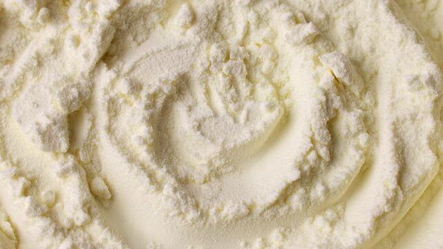 White powdered milk or baby formula texture circle rotation close up top view