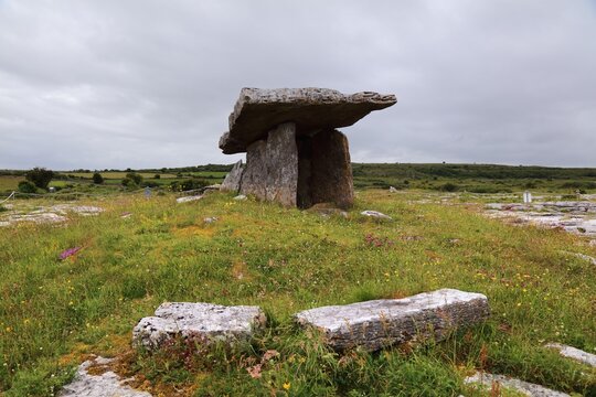 Poulnabrone dolmen in Ireland. Stone age portal tomb in The Burren, County Clare. Rainy day in Irish summer.