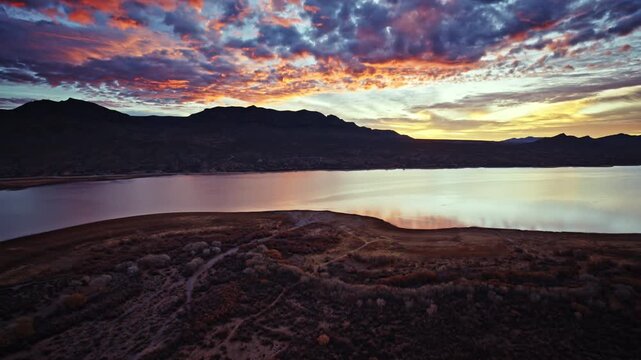 Cinematic aerial shot of early morning sunlight over Caballo Lake State Park in New Mexico.