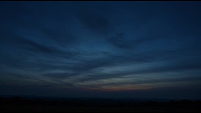 An atmospheric dusk sky with mesmerizing cloud formations and a subtle gradient of colors