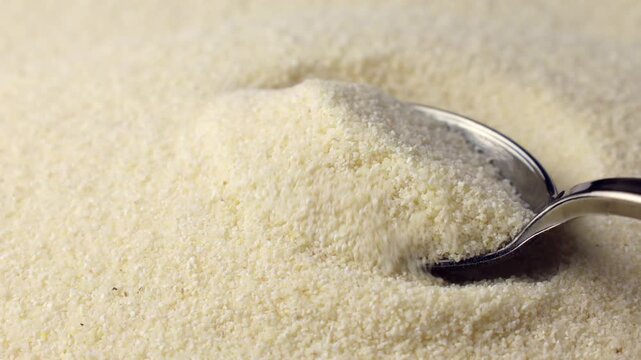 Semolina taking with a spoon close up