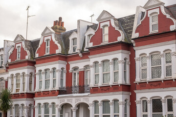 Fototapeta premium LONDON - Red and white Victorian terraced houses in West London