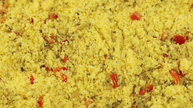 Yellow chicken stock powder seasoning texture circle rotation close up