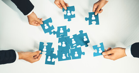 Top view panorama banner of business team assembling jigsaw puzzle over table symbolize business...