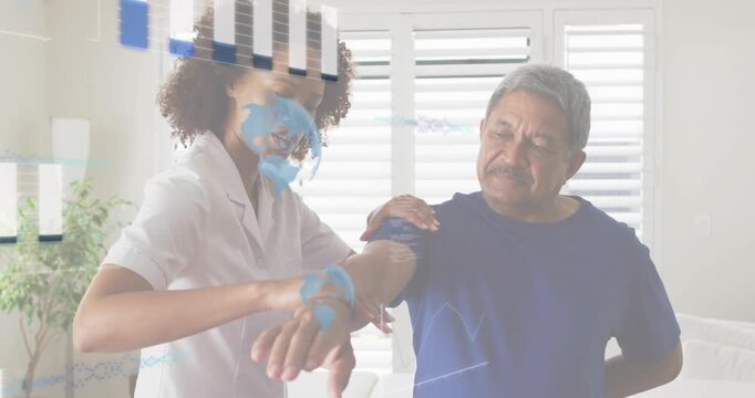 Physical therapist lifting patient forearm and initiating animated bar charts measuring mobility