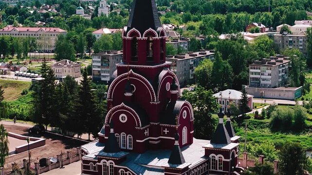 An Orthodox Christian church on the background of a provincial town. Cool aerial shots of the church
