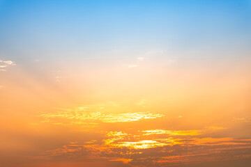 Fototapeta premium Beautiful luxury soft gradient with orange gold clouds and sunlight on the blue sky perfect for the background, take in everning,morning,Twilight, high definition landscape photo