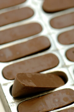 Gianduiotti or Gianduiotto is a typical food from Piemonte or Piedmont area made with cocoa and nuts in Italy