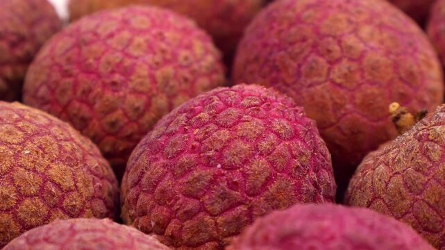 Bright red lychee fruit circle rotation close up