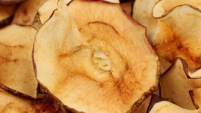 Dried apple slices circle rotation close up