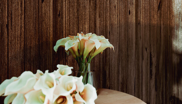 Elegant white calla lilies in a glass vase on a wooden table against a textured wall. Illustration, rendering
