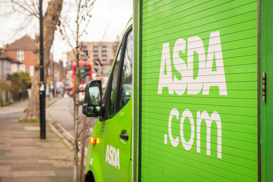 HANWELL, LONDON-  Asda delivery van on suburban street &ndash; everyday retail logistics scene West London.