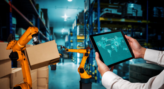 Smart robot arm systems for innovative warehouse and factory digital technology . Automation manufacturing robot controlled by industry engineering using IOT software connected to internet network .