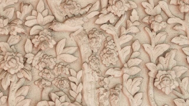 Plasterwork, wall art, bas-relief sculpture, floral and leaf shapes.