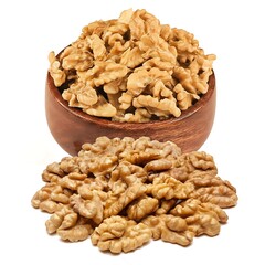 Fototapeta premium A wooden bowl overflowing with walnuts on white background