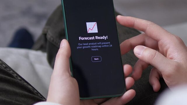 Entrepreneur Checking Business Forecast Results on Mobile App. POV shot of a user waiting for an analyst roadmap on a smartphone. Captures the essence of startup culture, wealth management, and tech