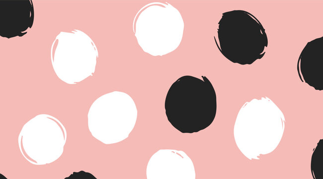 Abstract hand-drawn polka dot pattern with black and white brush circles on a pink background design