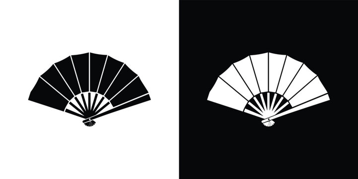 Black and white hand fan on white and black background