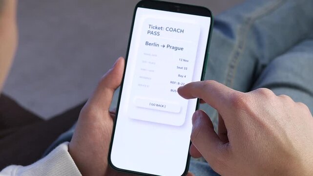 Using Travel Booking Application on Mobile Device to View Ticket. Smartphone user opening electronic bus ticket in mobile app. Clean minimalist UI showing trip details. Ideal for fintech, transport